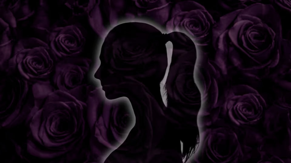 A dark silhouette of a woman in profile with her hair in a ponytail, centered against a background of deep purple roses.