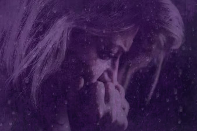 anxious woman with purple overlay